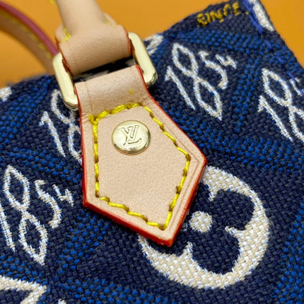 PETIT SAC PLAT BLUE MONOGRAM SINCE 1854 TEXTILE