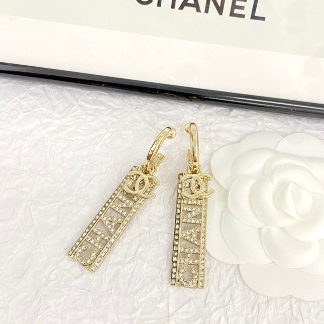 CC TEXT DIAMOND PAVED LIGHT GOLD DROP EARRINGS