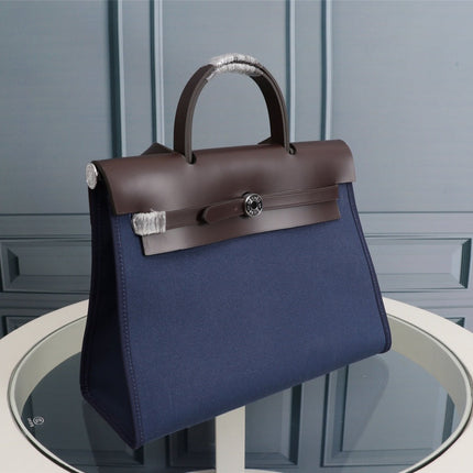 HM HERBAG ZIP 31 NAVY AND CHOCOLATE CANVAS